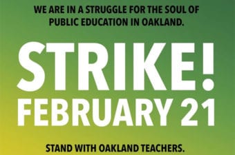 Stand with Oakland Teachers Strike sign on green backgroundd