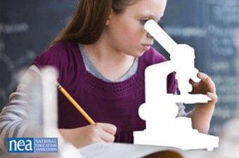 Student sitting looking through a telescope writing in a notebook