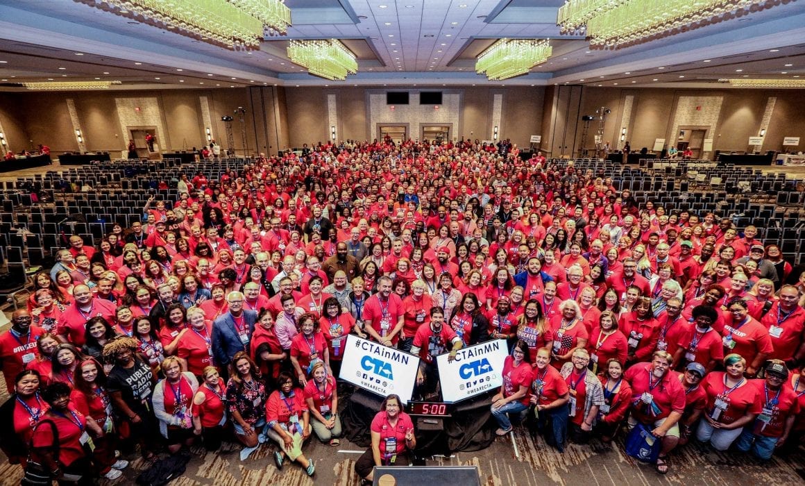 A sea of educators wearing red