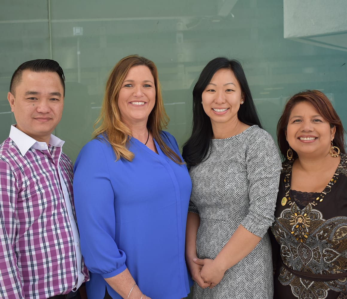 Four teachers standing together