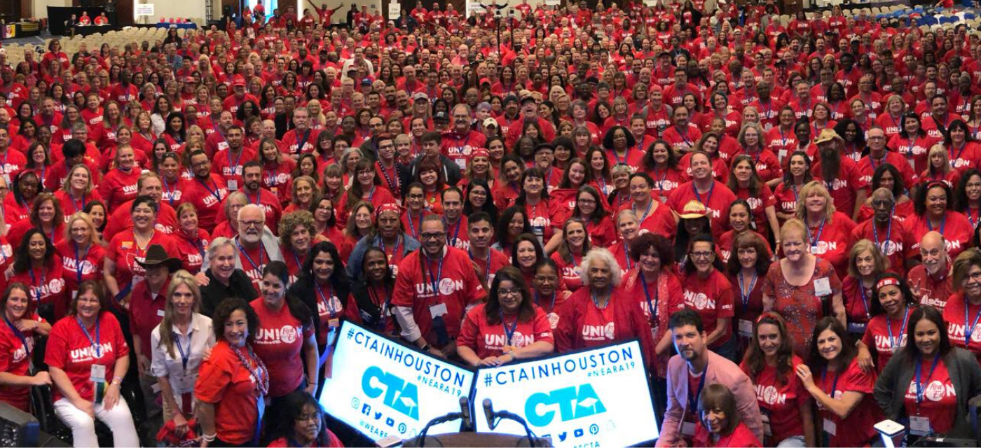 large group of people gathered wearing red