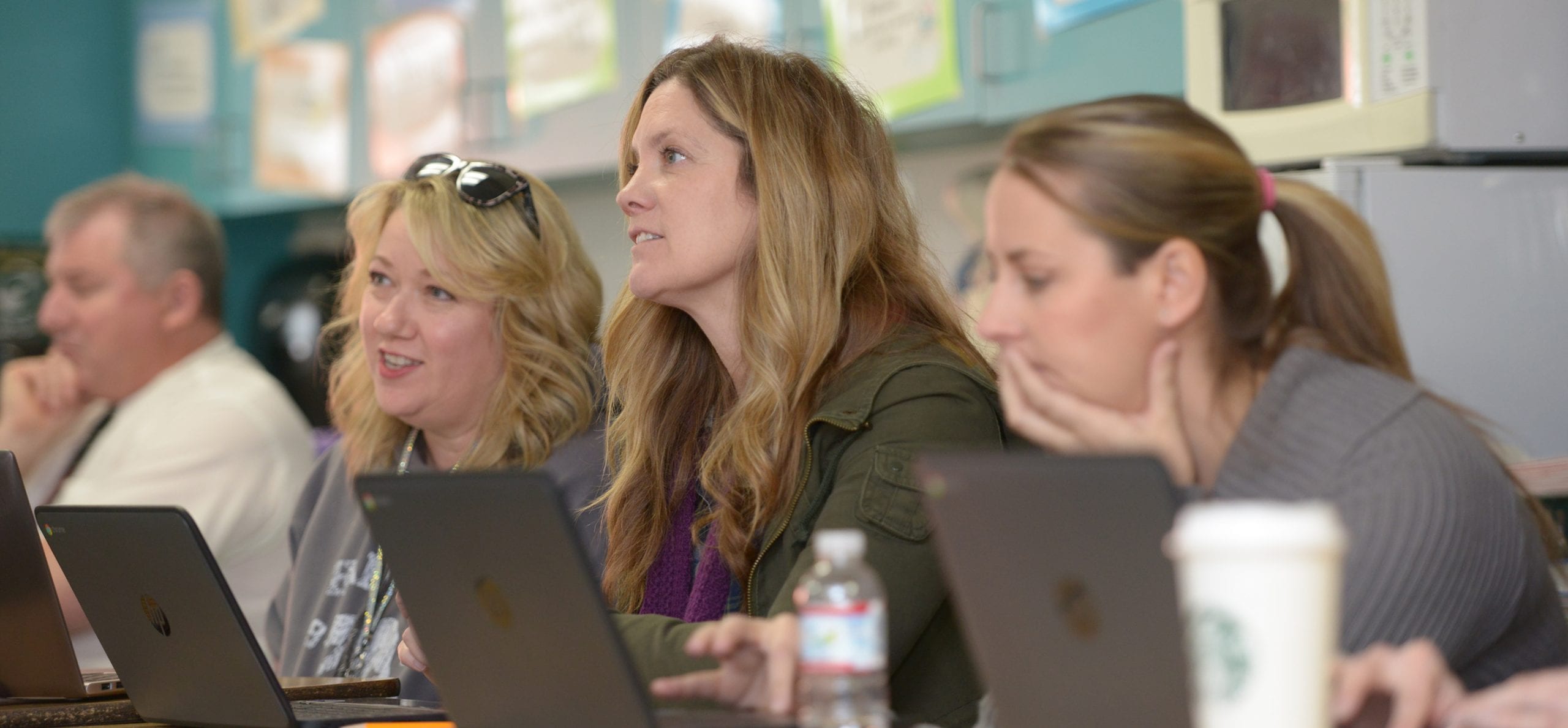 Teachers listen to Mikaela Koppers' talk about Google apps