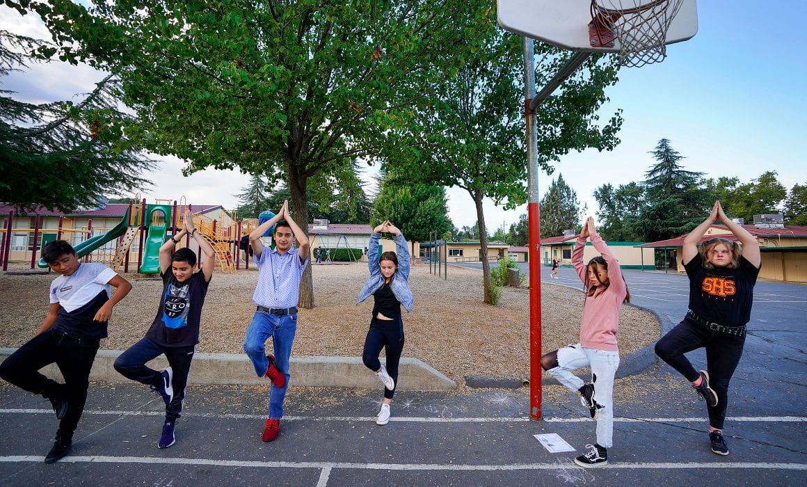 Students dancing on basketball court
