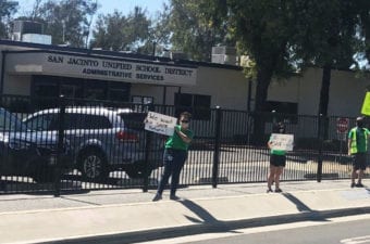 SJTA members maintain social distance during their organizing activity in front of SJUSD office