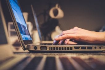 Stock photo of person typing on laptop