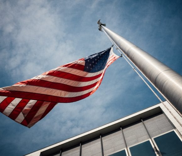 United States flag blows in the air