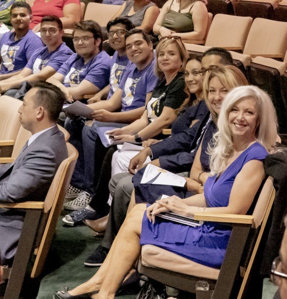 Donna Woods seated in audience at award ceremony