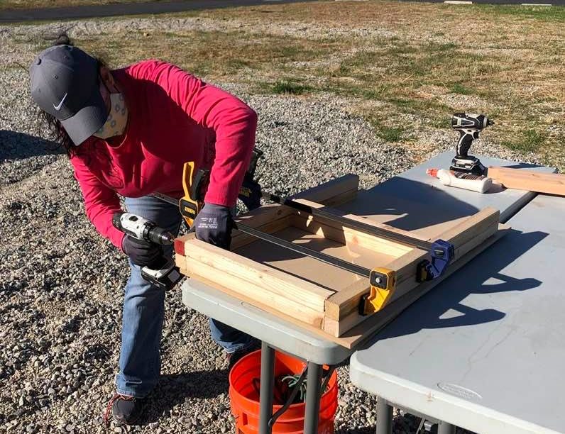 Man building wooden desk