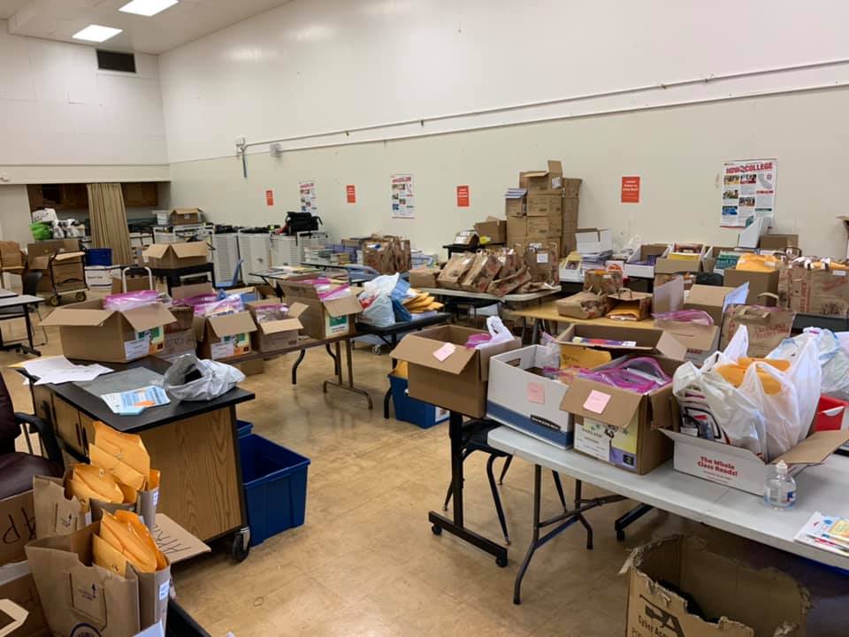The building is closed, but teaching and learning never stopped! This is a photo of materials distribution to remote learners at Futures & CUES at Lockwood. 