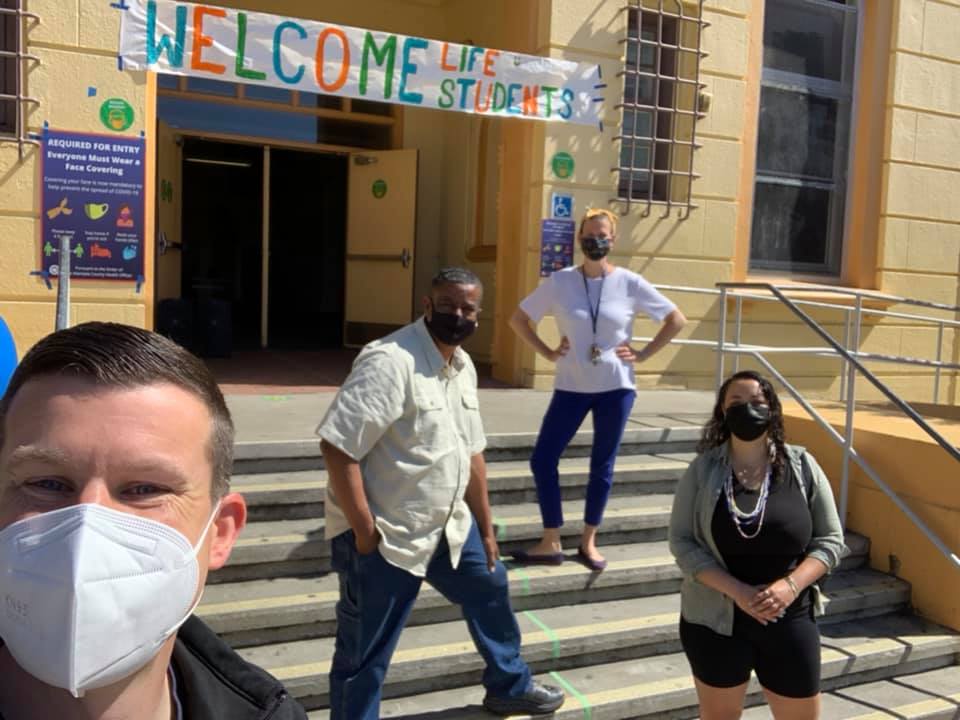 CTA staff and OEA Co-Executive Director John Green, Co-Principal Salazar Bowman, OEA school site representative Amy Ortiz, and Hunter conduct a safety walkthrough at Life Academy. 