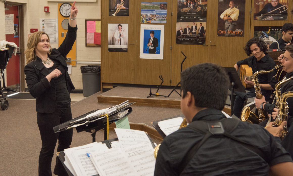 Amy Rangel conducting a student band