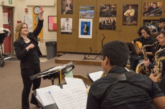 Amy Rangel conducting a student band