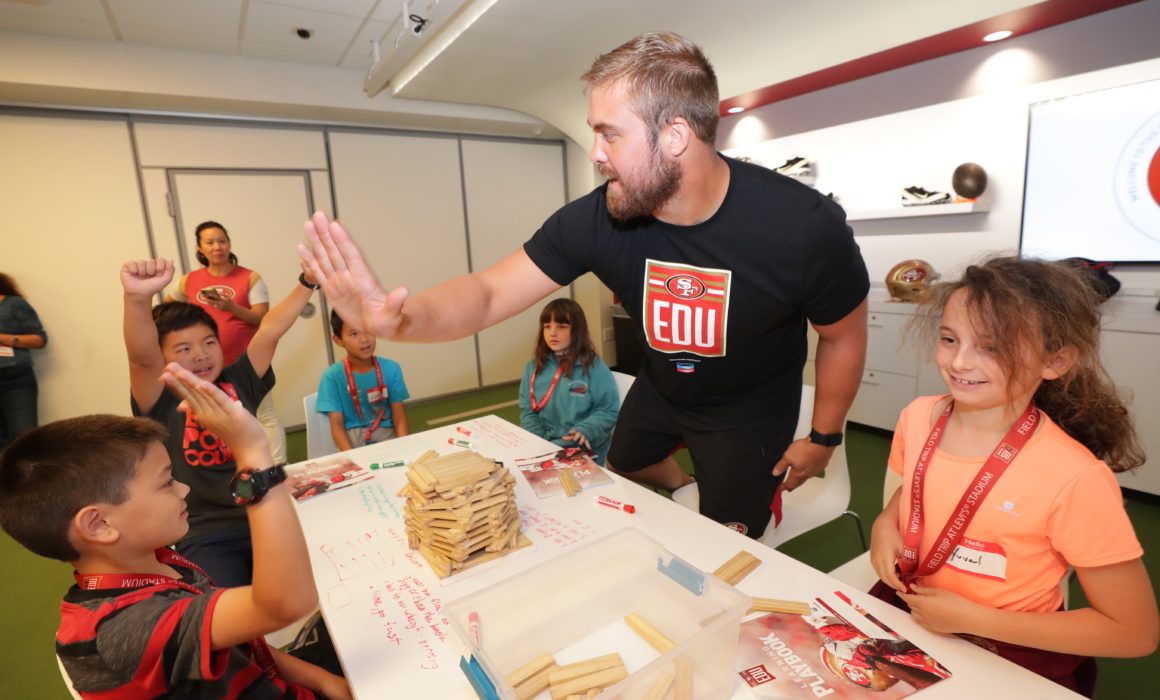 Former 49ers player Ben Garland with students.