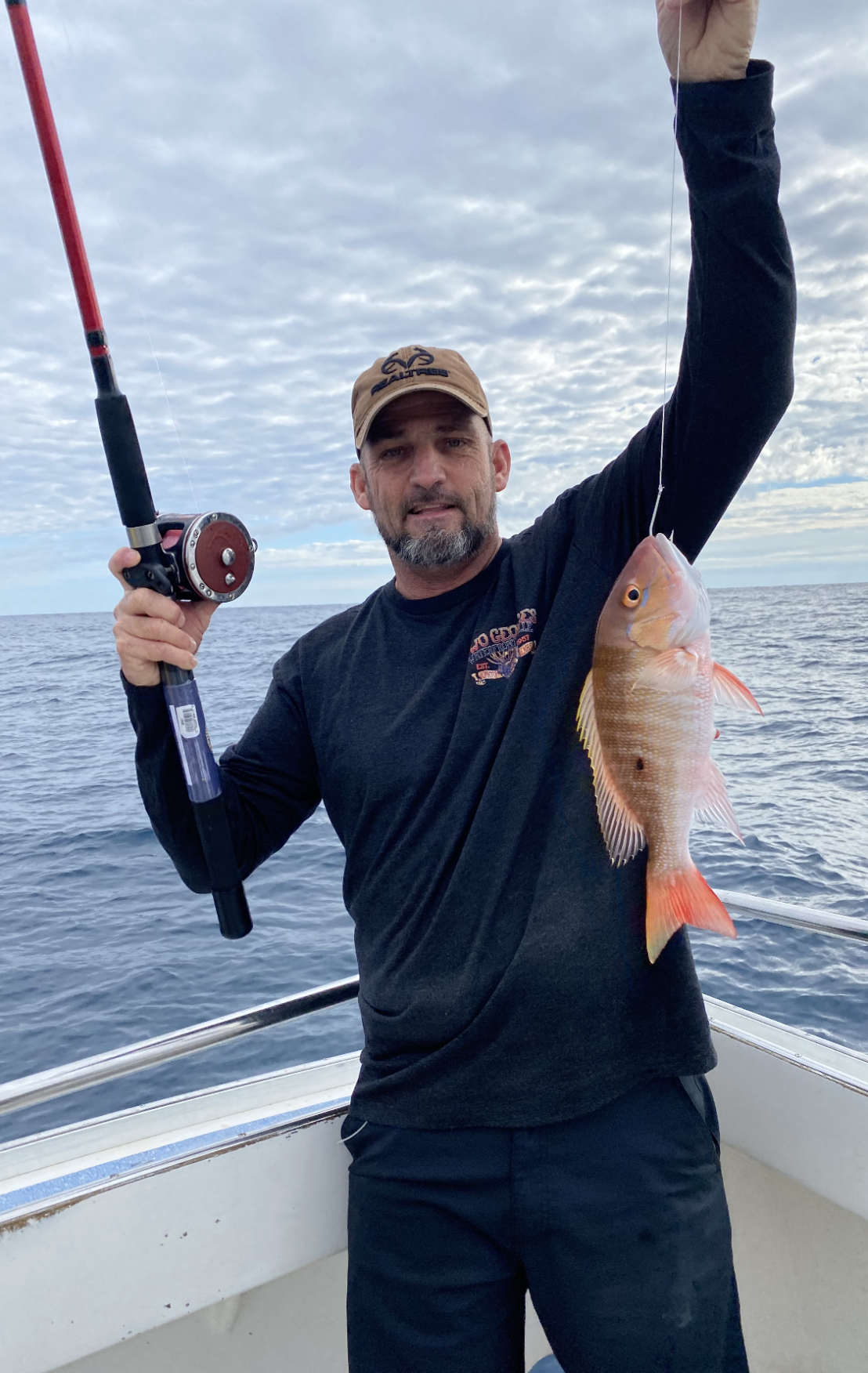 Eric Abrams with fish he has caught.