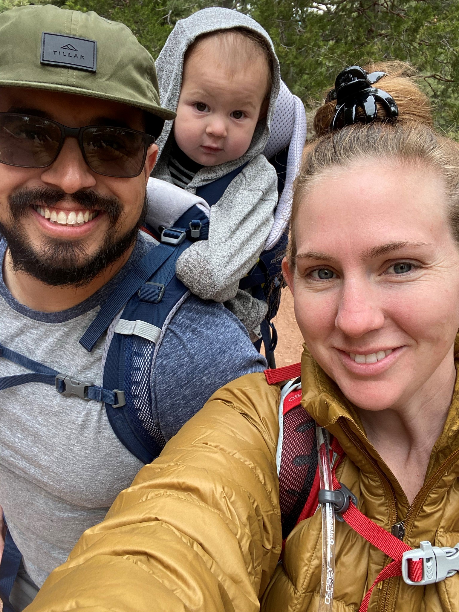 Selfie of Lindsay Estrada with husband and child on camping trip.