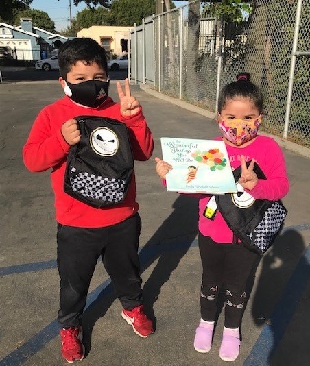 Children showing free books they've received