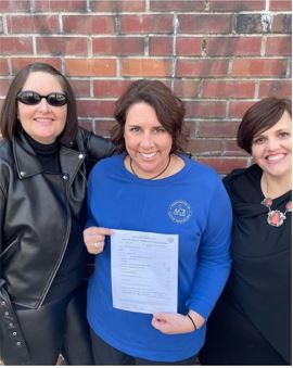 Tamara Soemali, Kristin Heimerdinger and Amy Kilburn celebrate the voting results that gave ACE official recognition.