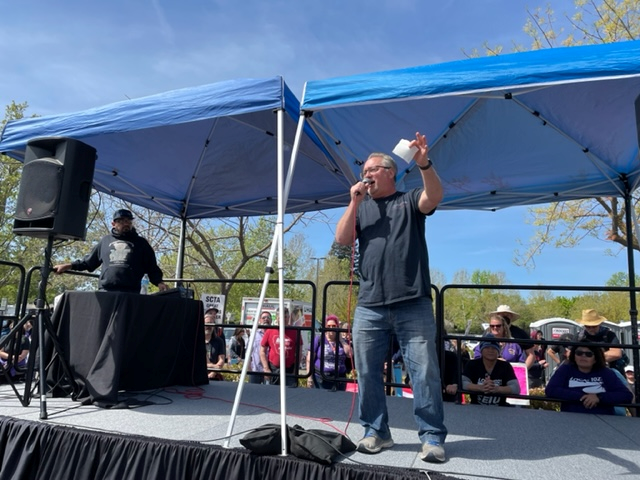 A speaker at a rally during Sacramento strike.