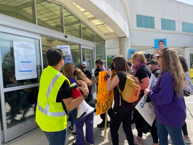 The bargaining team walks into the Serna Center this morning. 