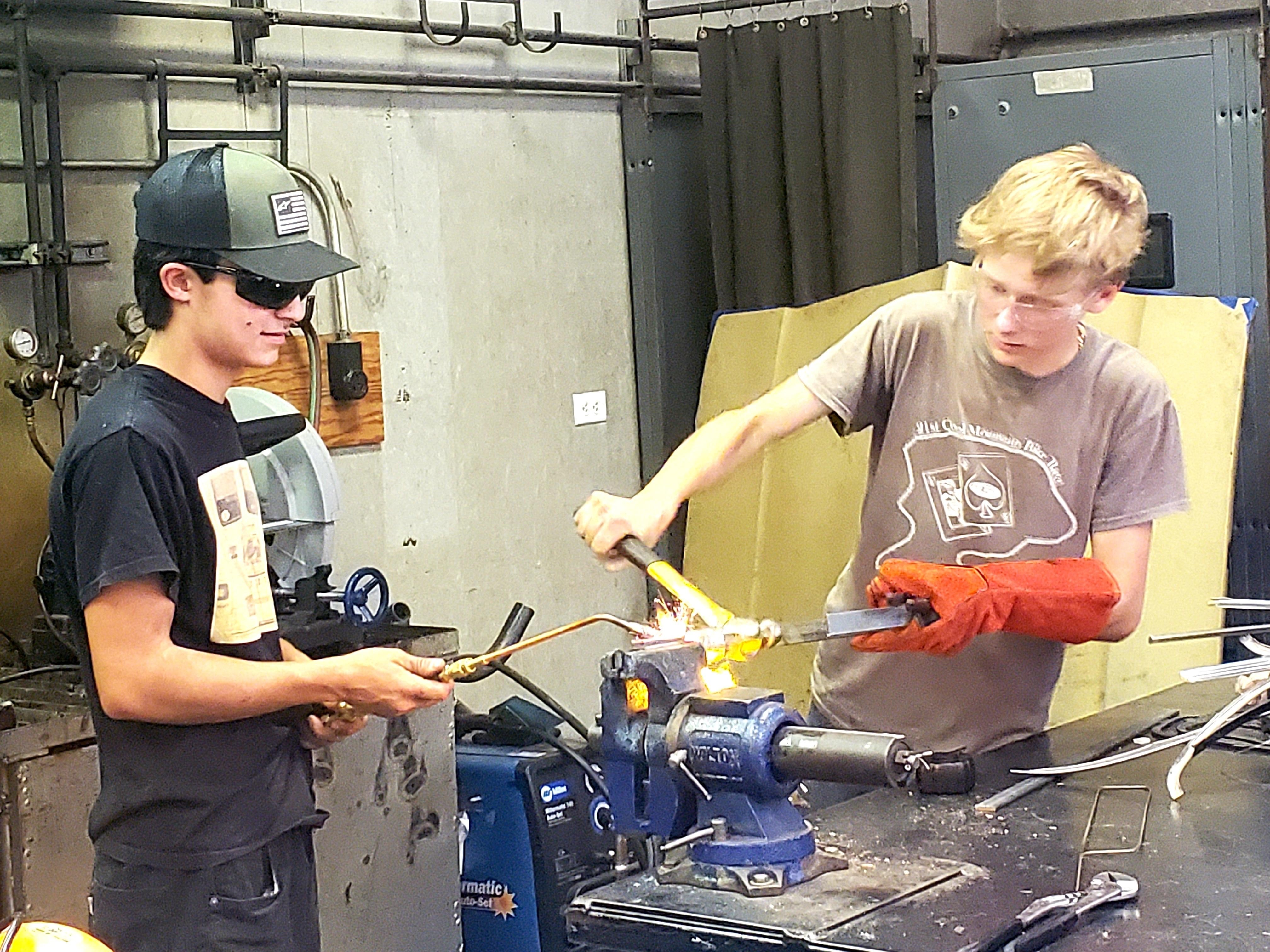 students learning auto shop