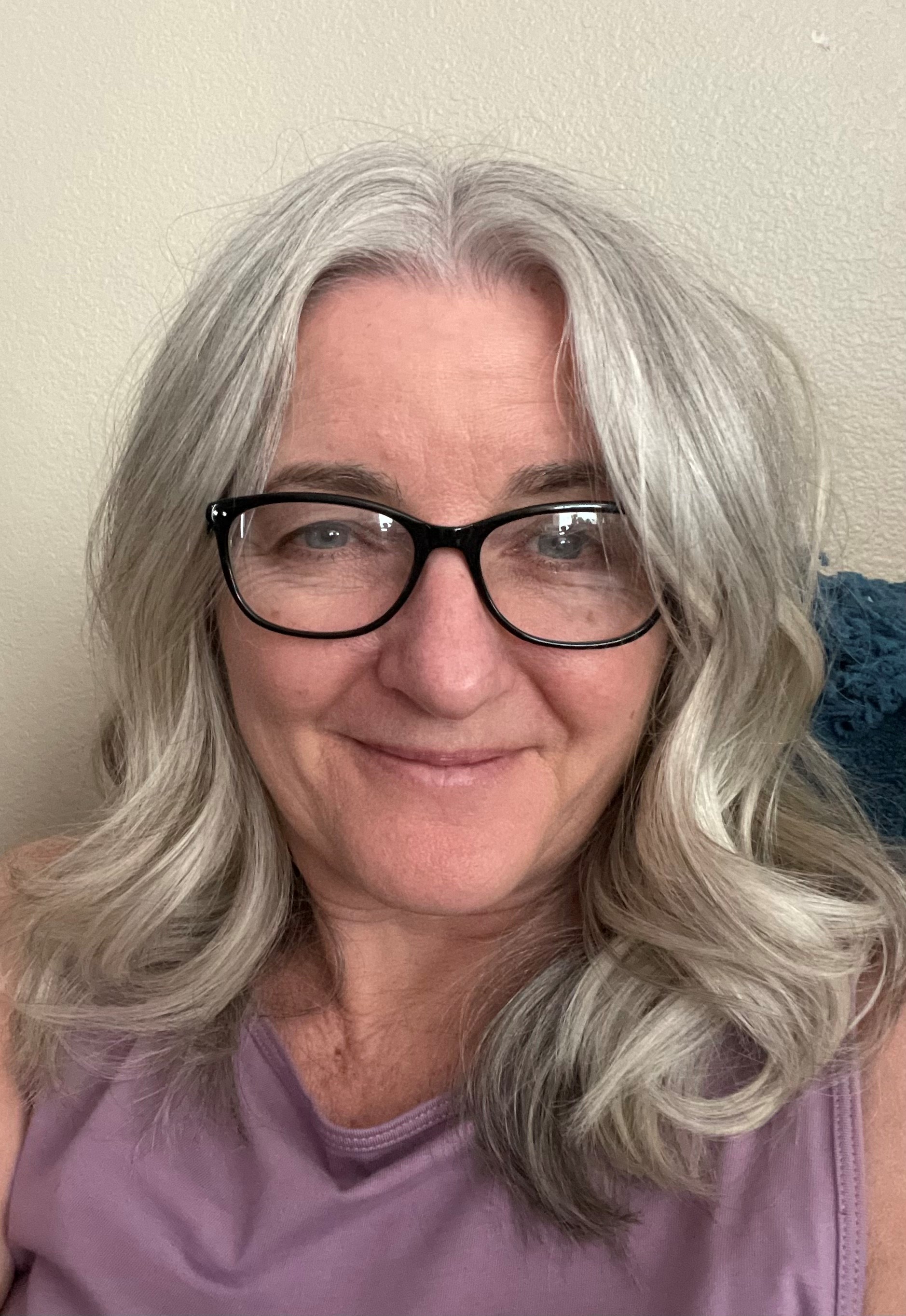 silver haired teacher wearing glasses