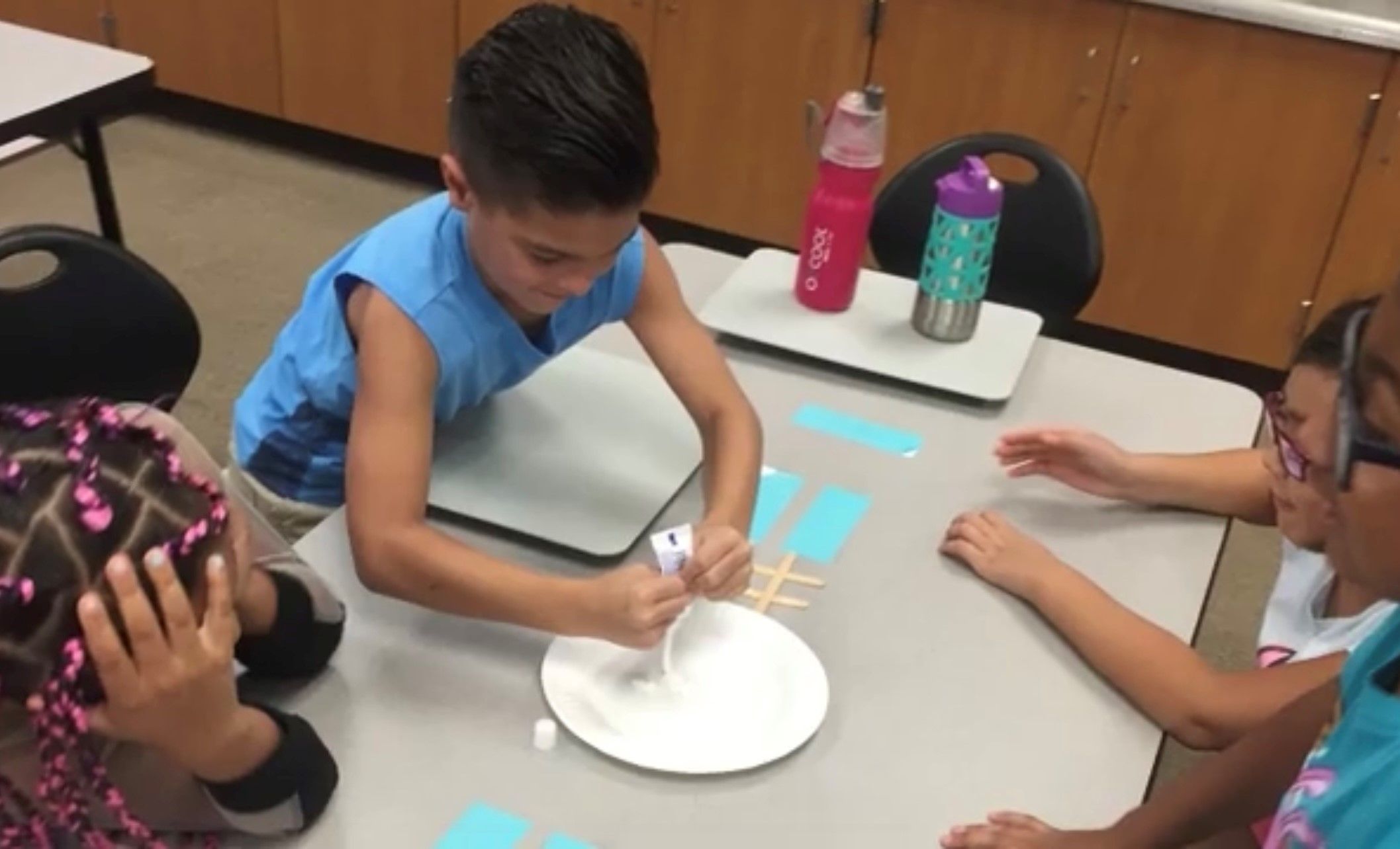 Students Squeeze Toothpaste on Plate