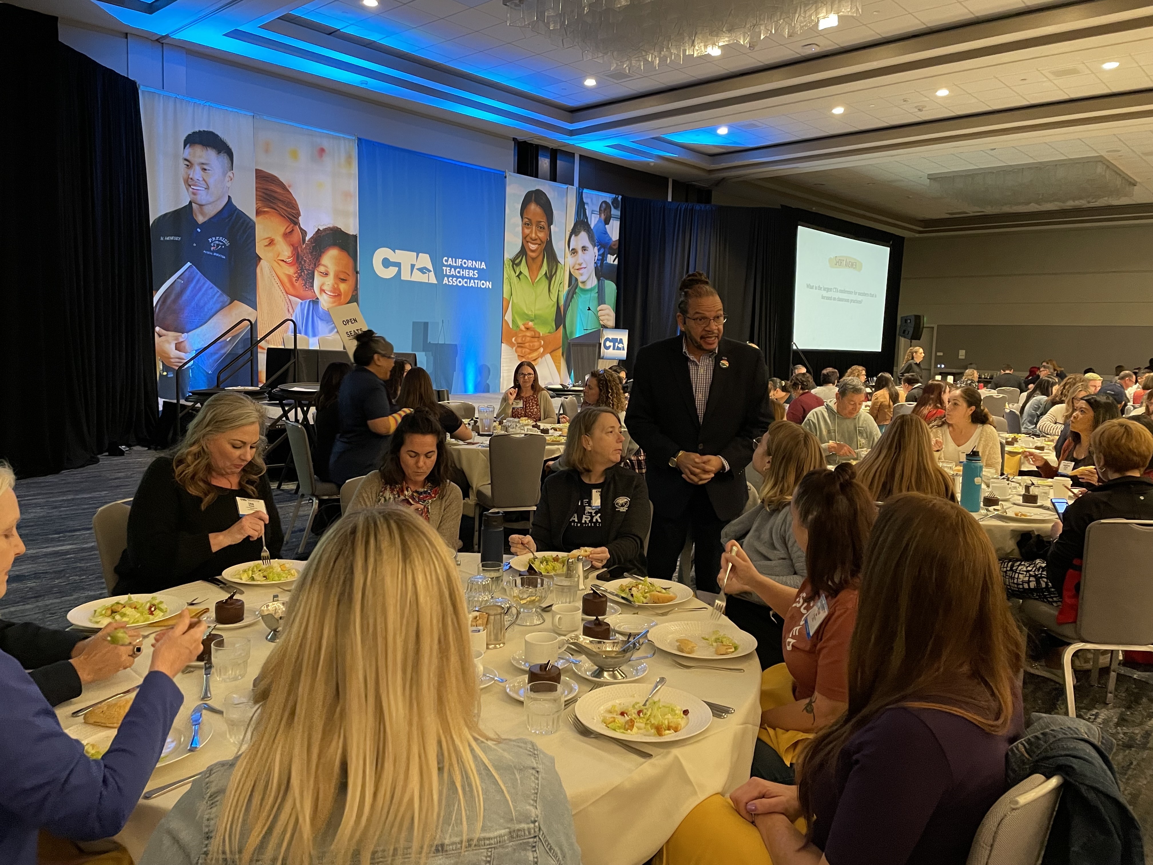 CTA President E. Toby Boyd checks in on members before his keynote on Saturday.