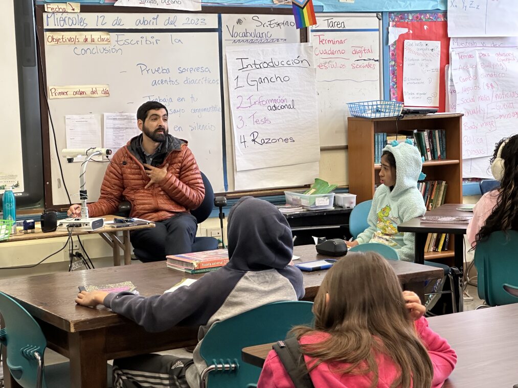 Bilingual teacher Marcos Espino with 7th grade students.