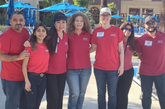 A group of people wearing red t-shirts.