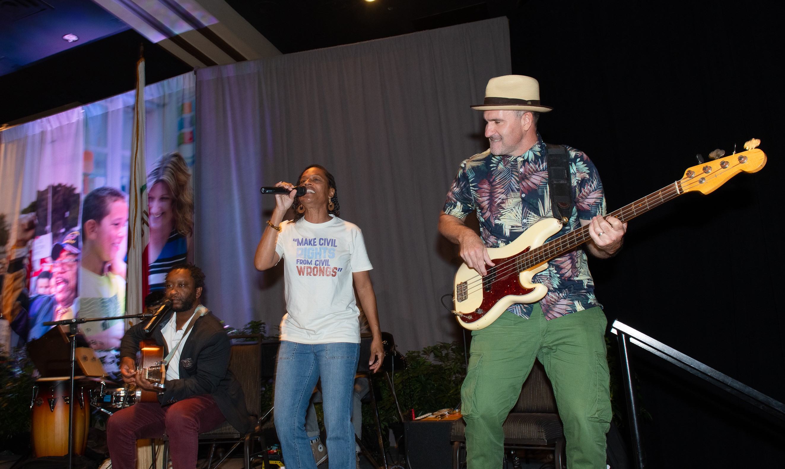 Alum Rock Educators Association member Veronica Talton joined musicians including Ozomatli bassist Wil-Dog Abers (at right) onstage. 