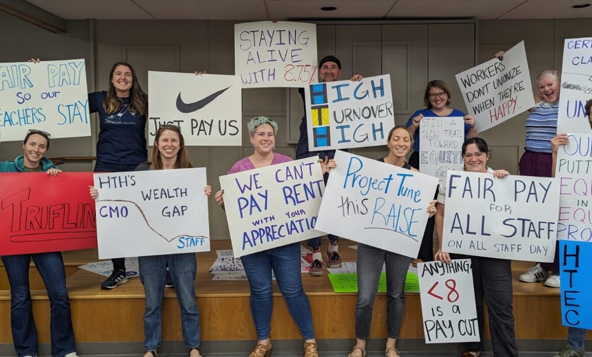 High Tech Education Collective holding signs for first contract