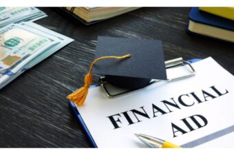 Photo of a financial aid application and a graduation cap.