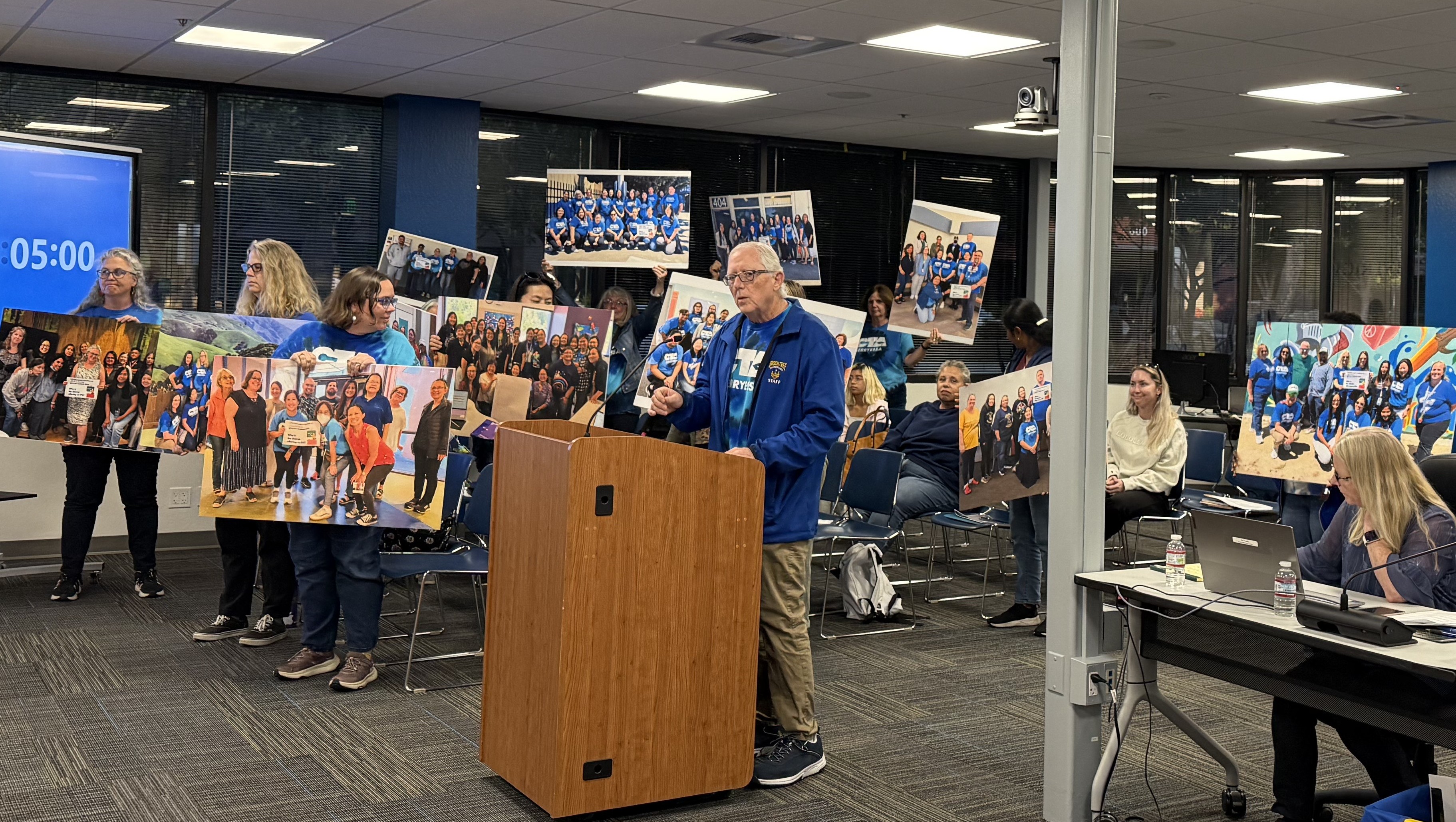 President JoeHermann speaks to the school board about their bargaining goals.