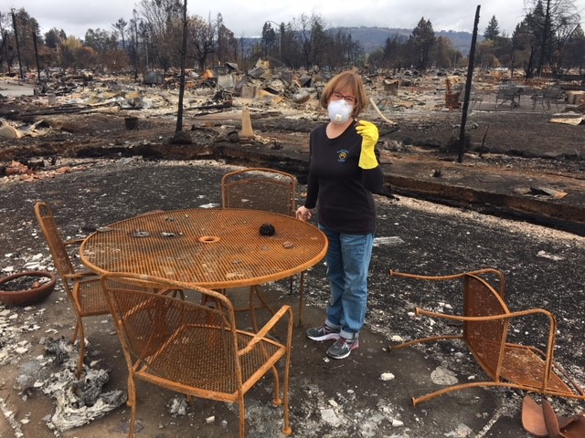 Lesley Van Dordrecht stands amid the ruins of her house in Santa Rosa’s Coffey Park. (Photo courtesy of Lesley Van Dordrecht)